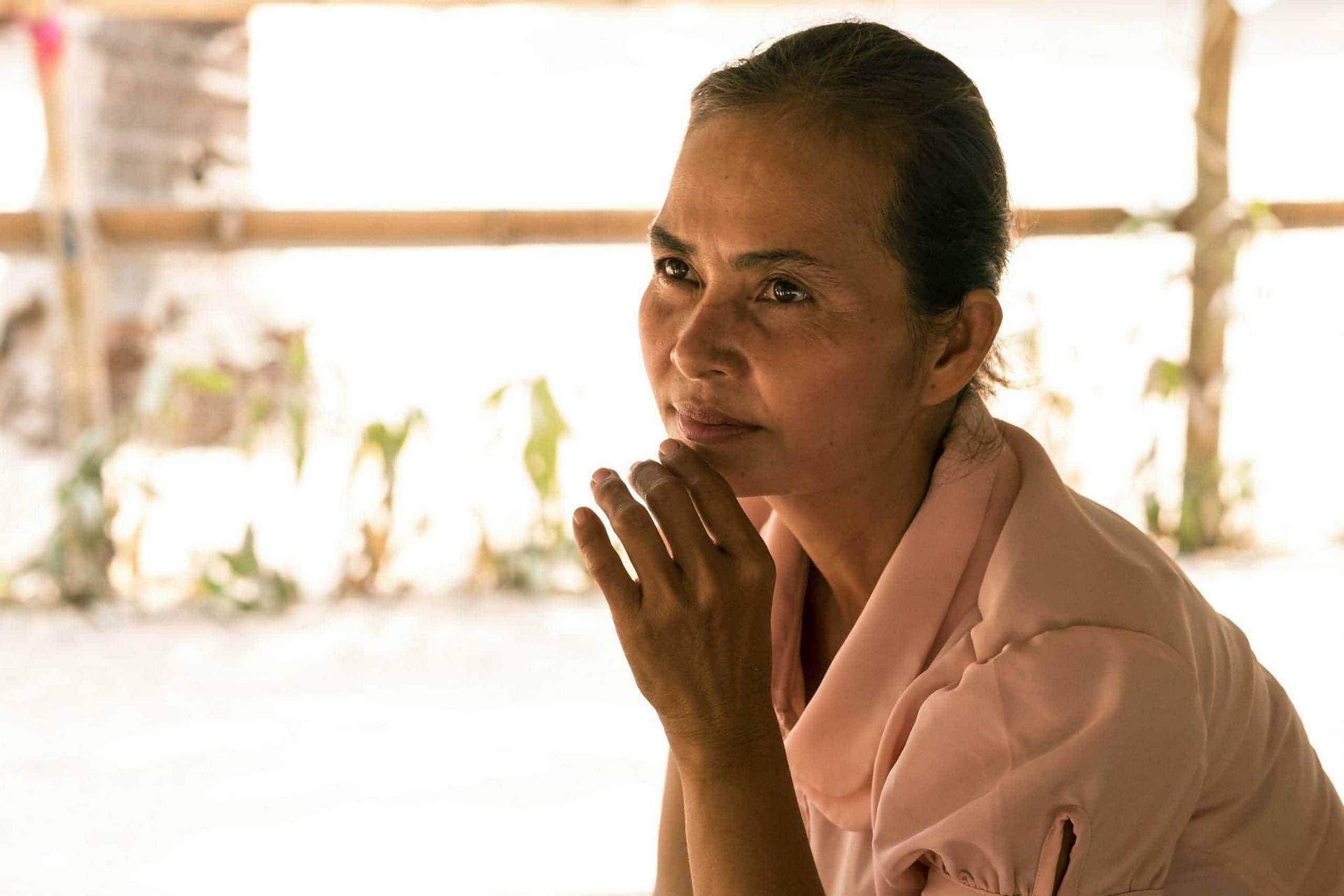 A Children in Families' mother sits and thinks about the future