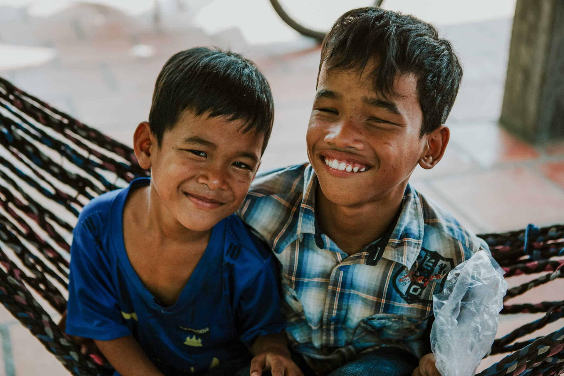Two Of Children In Families S Able Clients Sit In A Hammock At Their Foster Home